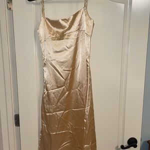 Dealwithyou boutique satin champagne midi dress with slit. Adjustable straps.
